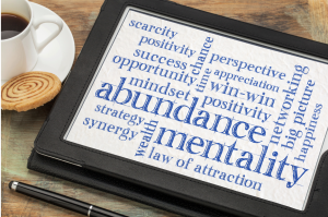 tablet showing positive words about abundance mentality