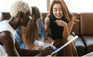 women of color having a discussion on a couch